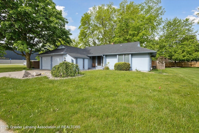 1098 Brookside Dr, Grand Ledge, MI 48837 - ranch-style home with an attached garage, driveway, and a shingled roof