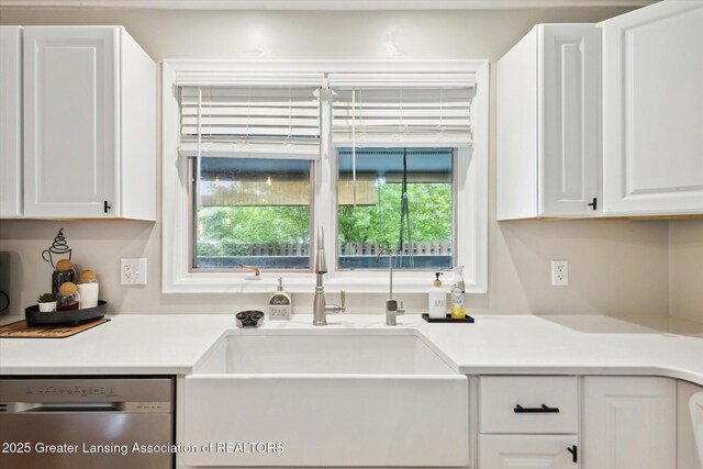 1098 Brookside Dr, Grand Ledge, MI 48837 - kitchen with dishwasher, a sink, white cabinets, and light countertops