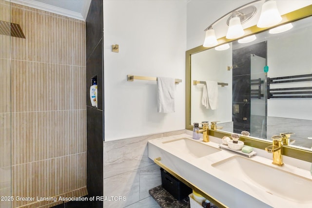 1098 Brookside Dr, Grand Ledge, MI 48837 - bathroom with tiled shower, crown molding, tile walls, and double vanity
