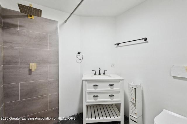 1098 Brookside Dr, Grand Ledge, MI 48837 - full bathroom with a tile shower, toilet, and vanity