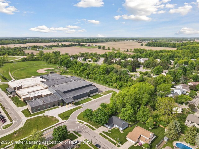 1098 Brookside Dr, Grand Ledge, MI 48837 - aerial view of property and surrounding area featuring a tree filled landscape
