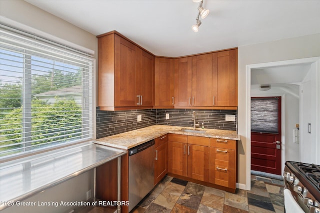 1023 N Hayford Ave, Lansing, MI 48912 - kitchen featuring stainless steel appliances, a sink, stone finish flooring, tasteful backsplash, and light stone countertops