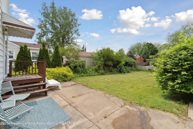 1023 N Hayford Ave, Lansing, MI 48912 - view of grassy yard with a patio and a deck