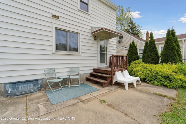 1023 N Hayford Ave, Lansing, MI 48912 - view of exterior entry with a patio area and a wooden deck