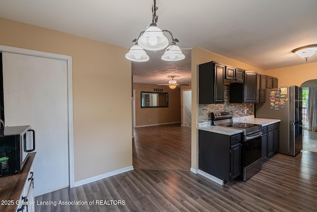 522 W Hodge Ave, Lansing, MI 48910 - kitchen featuring appliances with stainless steel finishes, light countertops, dark wood-style flooring, backsplash, and ceiling fan