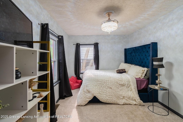 522 W Hodge Ave, Lansing, MI 48910 - carpeted bedroom featuring a textured ceiling and baseboards