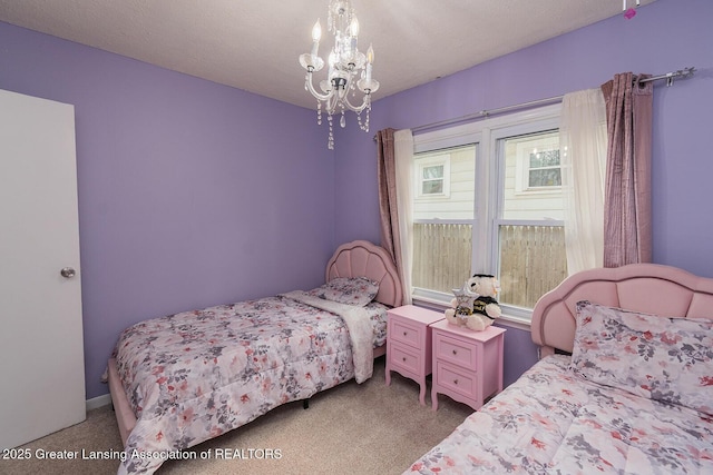 522 W Hodge Ave, Lansing, MI 48910 - carpeted bedroom featuring a chandelier