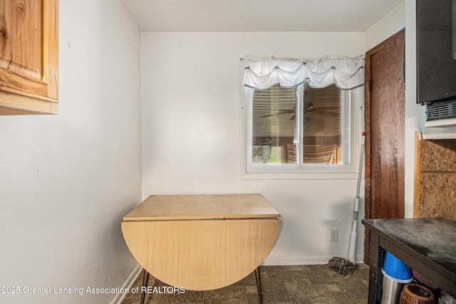 6327 Grovenburg Rd, Lansing, MI 48911 - bathroom featuring baseboards and stone finish floors