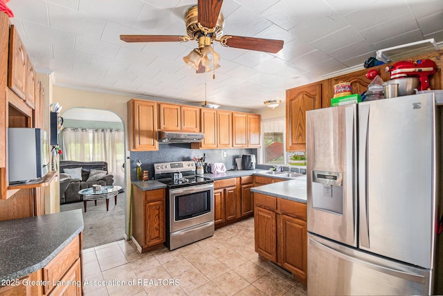 6327 Grovenburg Rd, Lansing, MI 48911 - kitchen with appliances with stainless steel finishes, under cabinet range hood, healthy amount of natural light, and a ceiling fan