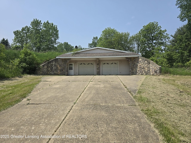 6322 Springport Rd, Eaton Rapids, MI 48827 - view of front of property with concrete driveway and a garage