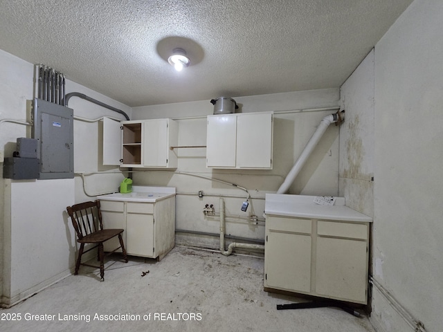 6322 Springport Rd, Eaton Rapids, MI 48827 - washroom featuring a textured ceiling and electric panel