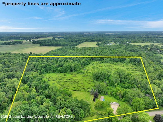 6322 Springport Rd, Eaton Rapids, MI 48827 - aerial view of property's location with property boundaries highlighted and a heavily wooded area