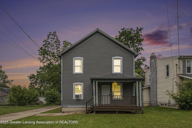 413 N Pennsylvania Ave, Lansing, MI 48912 - view of front facade featuring a porch and a lawn