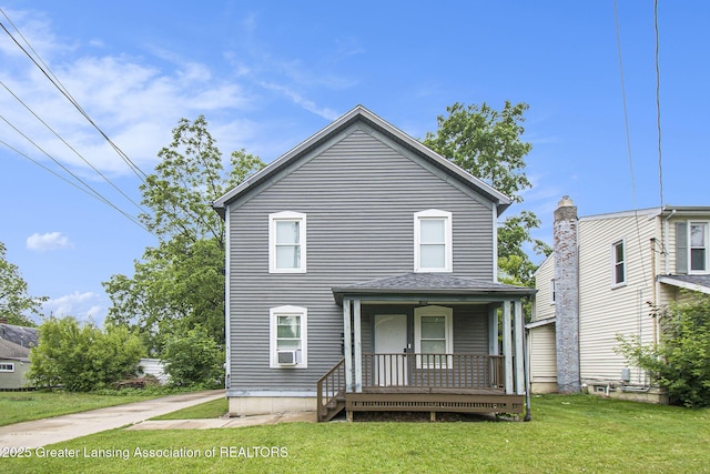 413 N Pennsylvania Ave, Lansing, MI 48912 - view of front of house with a porch and a front yard