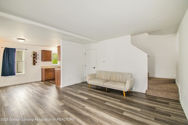413 N Pennsylvania Ave, Lansing, MI 48912 - living area featuring dark wood-style flooring, stairs, and baseboards