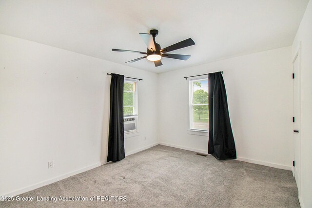 413 N Pennsylvania Ave, Lansing, MI 48912 - unfurnished room featuring a ceiling fan, light carpet, and baseboards