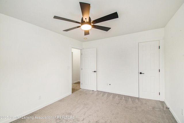 413 N Pennsylvania Ave, Lansing, MI 48912 - unfurnished bedroom with carpet floors, baseboards, and a ceiling fan