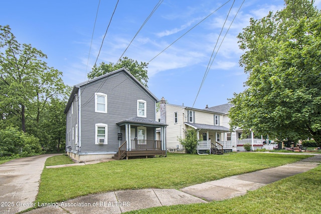 413 N Pennsylvania Ave, Lansing, MI 48912 - view of front of home with a front lawn and covered porch