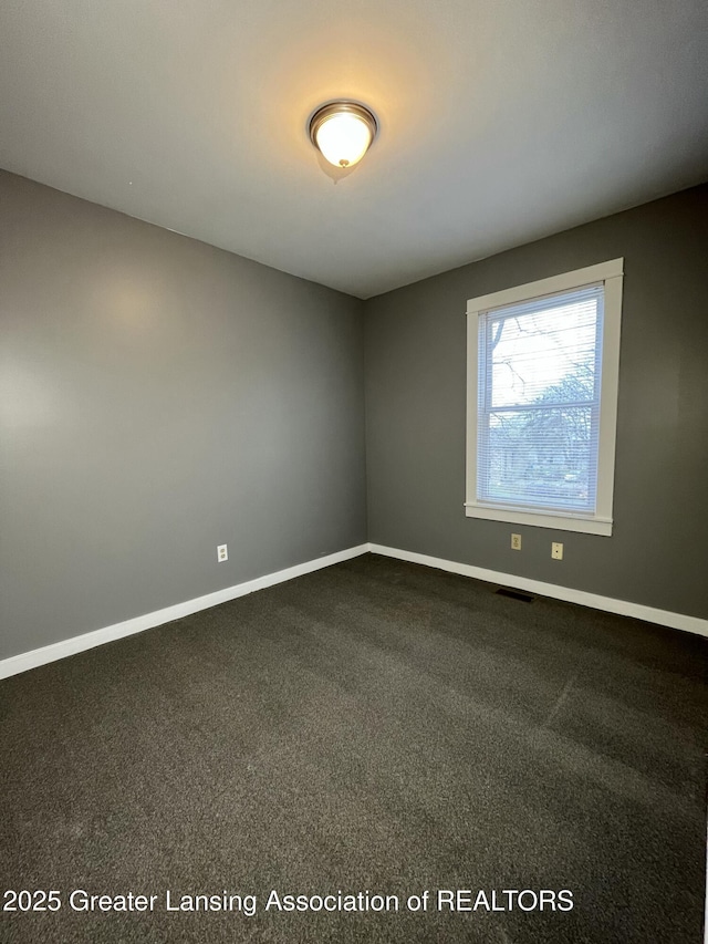 413 N Pennsylvania Ave, Lansing, MI 48912 - unfurnished room with baseboards and carpet floors