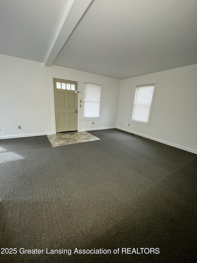 413 N Pennsylvania Ave, Lansing, MI 48912 - entryway with baseboards and dark carpet