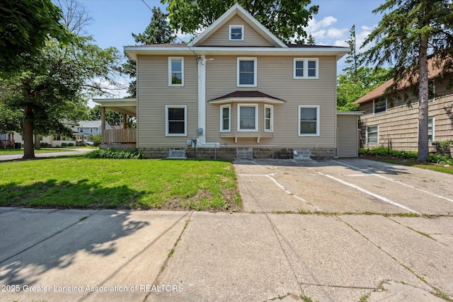 402 W Cesar E Chavez Ave, Lansing, MI 48906 - american foursquare style home featuring a front yard