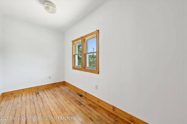 402 W Cesar E Chavez Ave, Lansing, MI 48906 - unfurnished room featuring light wood-style flooring and baseboards