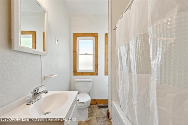 402 W Cesar E Chavez Ave, Lansing, MI 48906 - full bathroom with toilet, vanity, and shower / bath combination with curtain