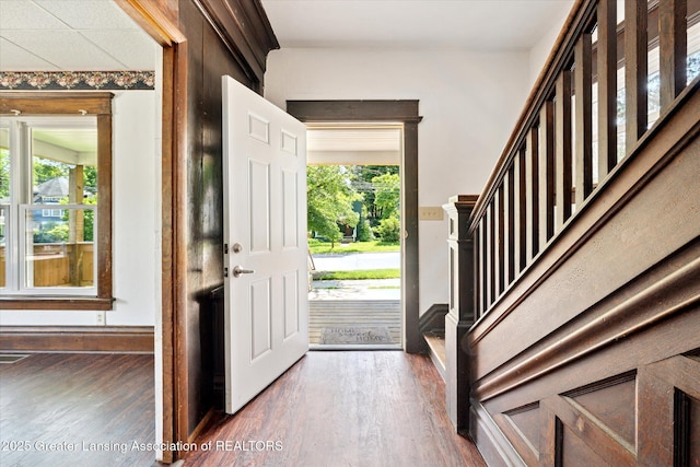402 W Cesar E Chavez Ave, Lansing, MI 48906 - entryway with wood finished floors, stairway, and baseboards