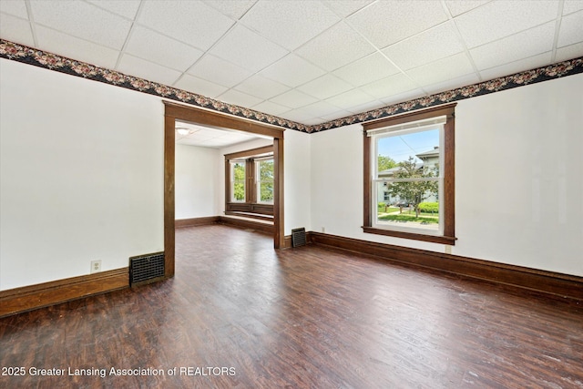402 W Cesar E Chavez Ave, Lansing, MI 48906 - empty room featuring dark wood-style flooring and baseboards