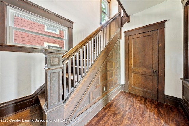 402 W Cesar E Chavez Ave, Lansing, MI 48906 - stairway featuring wood finished floors and baseboards