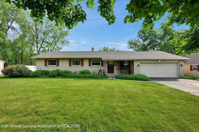 7713 Jon Scott Dr, Grand Ledge, MI 48837 - single story home featuring an attached garage, driveway, a front lawn, a chimney, and brick siding