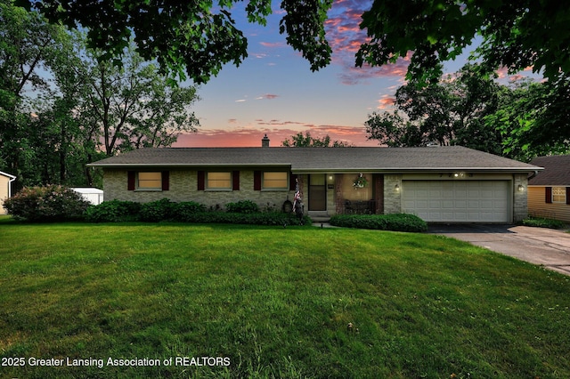 7713 Jon Scott Dr, Grand Ledge, MI 48837 - ranch-style house with an attached garage, driveway, a front yard, and a chimney