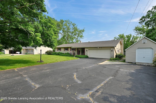 7713 Jon Scott Dr, Grand Ledge, MI 48837 - ranch-style house with a front lawn, brick siding, and asphalt driveway