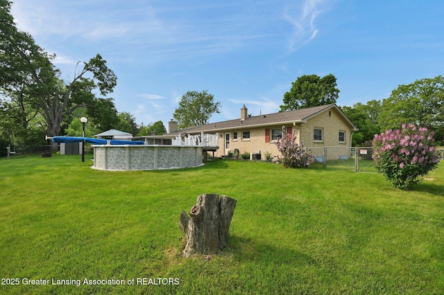 7713 Jon Scott Dr, Grand Ledge, MI 48837 - view of yard with a covered pool