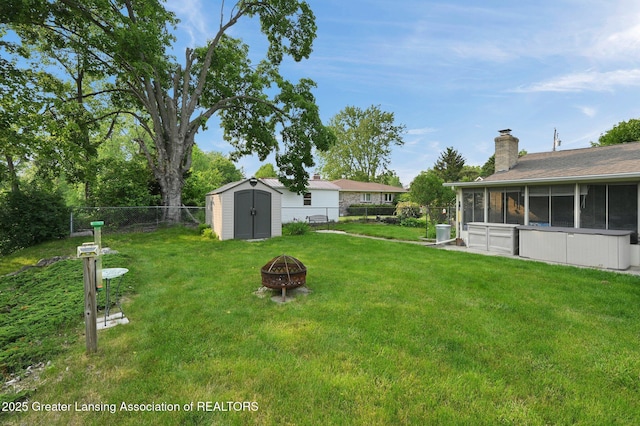 7713 Jon Scott Dr, Grand Ledge, MI 48837 - view of yard featuring a fire pit and a sunroom