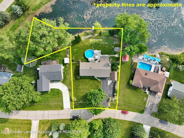 7713 Jon Scott Dr, Grand Ledge, MI 48837 - aerial view of property and surrounding area with a pool and property parcel outlined