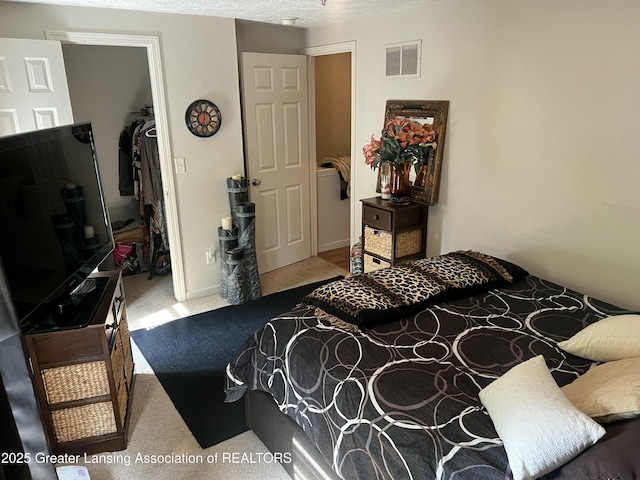1745 Maisonette Dr, Lansing, MI 48911 - carpeted bedroom featuring a closet and a walk in closet