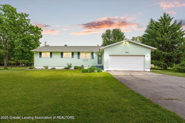 1941 S Royston Rd, Eaton Rapids, MI 48827 - ranch-style house with asphalt driveway, a garage, and a front yard