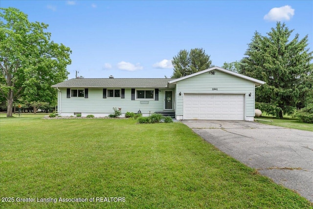 1941 S Royston Rd, Eaton Rapids, MI 48827 - single story home featuring asphalt driveway, a garage, and a front yard