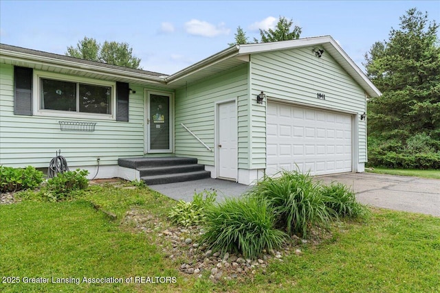 1941 S Royston Rd, Eaton Rapids, MI 48827 - single story home with concrete driveway, a garage, and a front yard