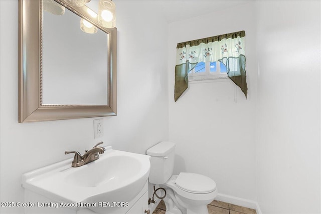 1941 S Royston Rd, Eaton Rapids, MI 48827 - half bath with toilet, vanity, and tile patterned flooring