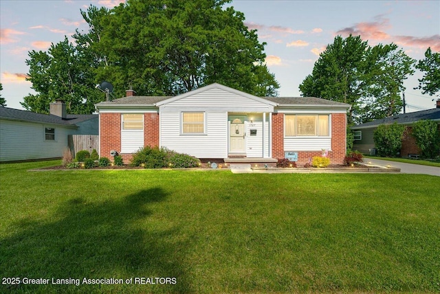 1727 Springfield Ln, Lansing, MI 48912 - view of front of property with brick siding and a front yard