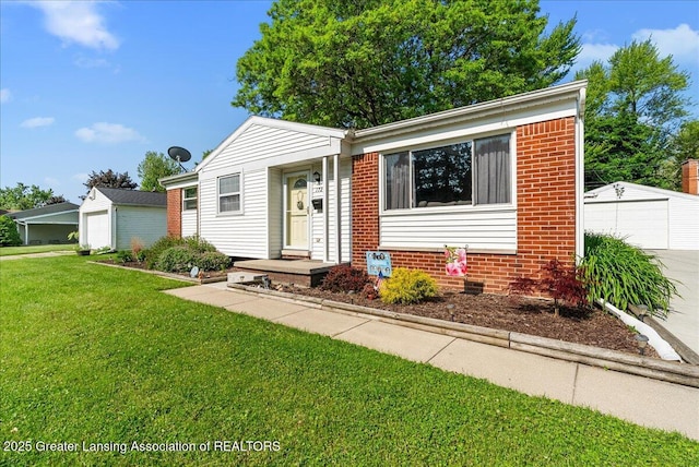 1727 Springfield Ln, Lansing, MI 48912 - view of front of home featuring a garage, a front lawn, an outbuilding, and brick siding