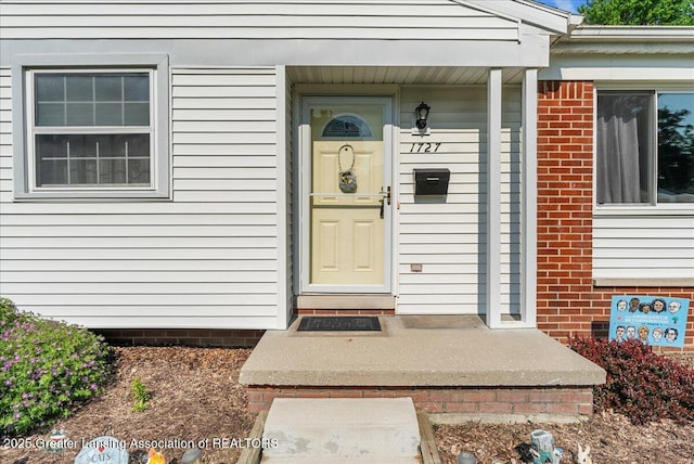 1727 Springfield Ln, Lansing, MI 48912 - doorway to property with brick siding