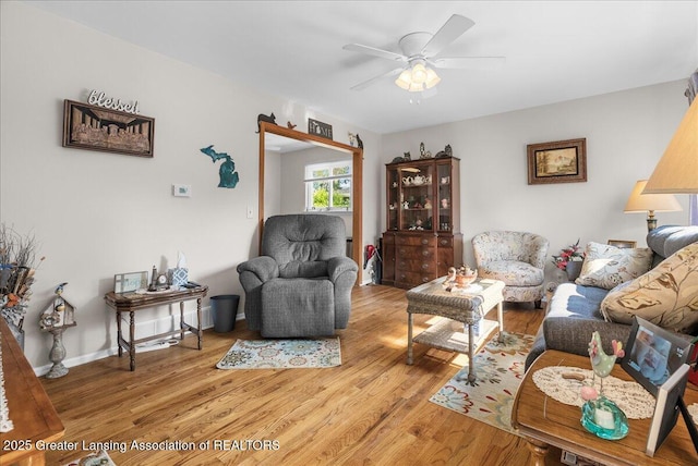 1727 Springfield Ln, Lansing, MI 48912 - living room with a ceiling fan and light wood-style floors
