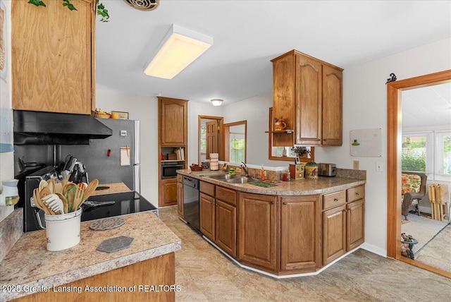 1727 Springfield Ln, Lansing, MI 48912 - kitchen featuring range hood, dishwasher, a sink, brown cabinets, and light countertops