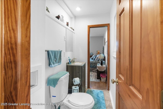 1727 Springfield Ln, Lansing, MI 48912 - bathroom featuring vanity and toilet