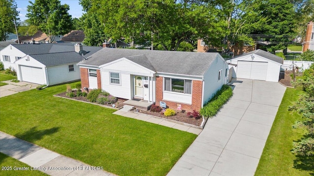 1727 Springfield Ln, Lansing, MI 48912 - view of front of home featuring brick siding, a detached garage, an outbuilding, a front lawn, and a shingled roof
