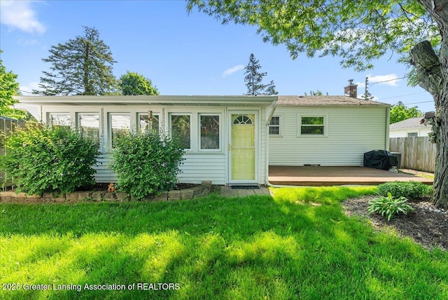 1727 Springfield Ln, Lansing, MI 48912 - ranch-style home featuring a deck and a chimney