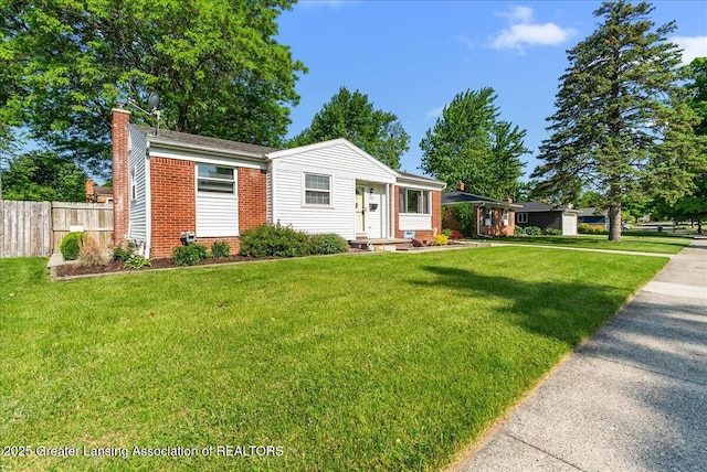 1727 Springfield Ln, Lansing, MI 48912 - view of front of home with a chimney and brick siding